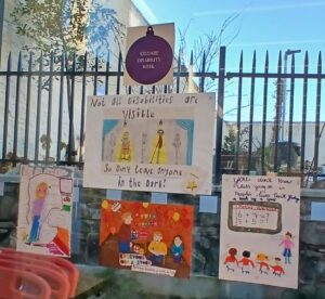 images of the posters on library window